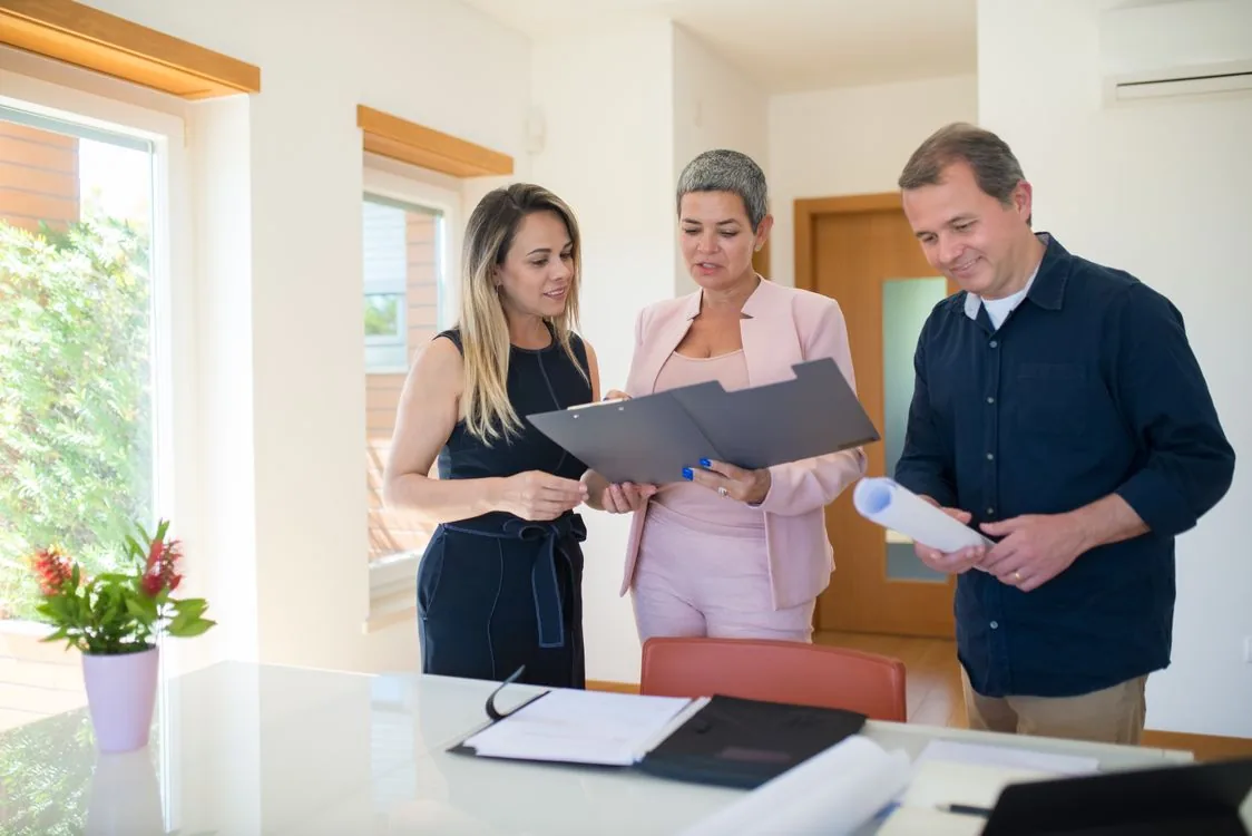 Real estate professionals reviewing a transaction together